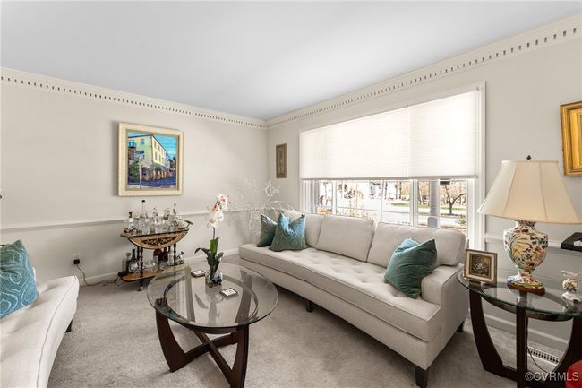 Living area with baseboards and carpet | Image 10