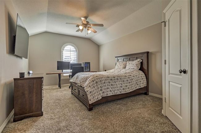 Spacious upstairs fourth bedroom with elegant plantation shutters. | Image 20