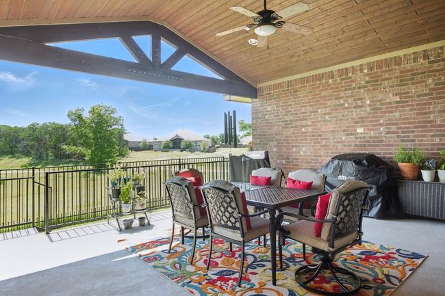 View of patio / terrace with ceiling fan, outdoor dining area, and a grill | Image 30