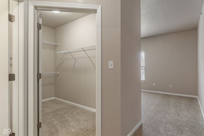 Primary bedroom is split from bedrooms 2 and 3, giving extra privacy | Image 19