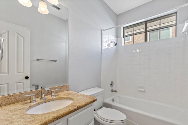 Another full bathroom combines practicality with a touch of style. | Image 27