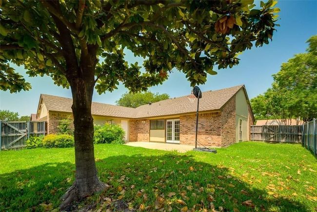 Rear view of house with french doors, brick siding, and a patio | Image 16