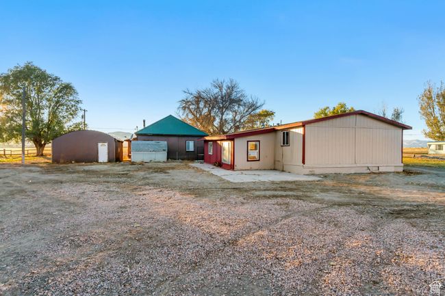 View of the back of the West home and the back of the East home with an additional outbuilding | Image 19