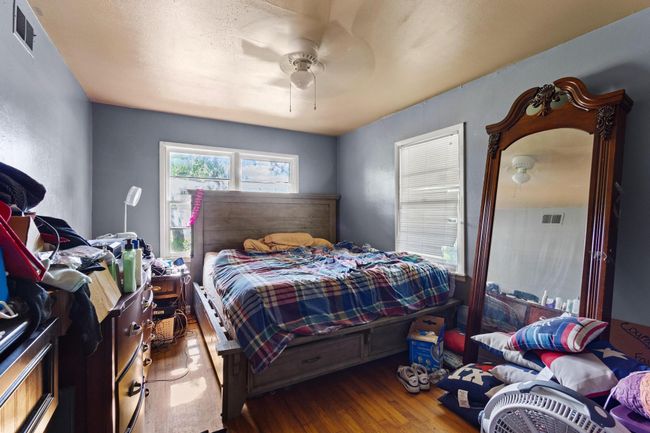 Bedroom featuring hardwood / wood-style floors and ceiling fan | Image 10