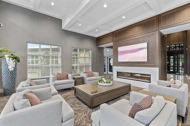 Interior space with beamed ceiling, a glass covered fireplace, recessed lighting, and coffered ceiling | Image 30