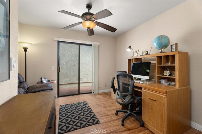 Here is a view of one of the secondary bedrooms with direct access to your private side yard area | Image 6