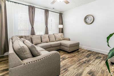 Living room with ceiling fan and hardwood / wood-style flooring | Image 3