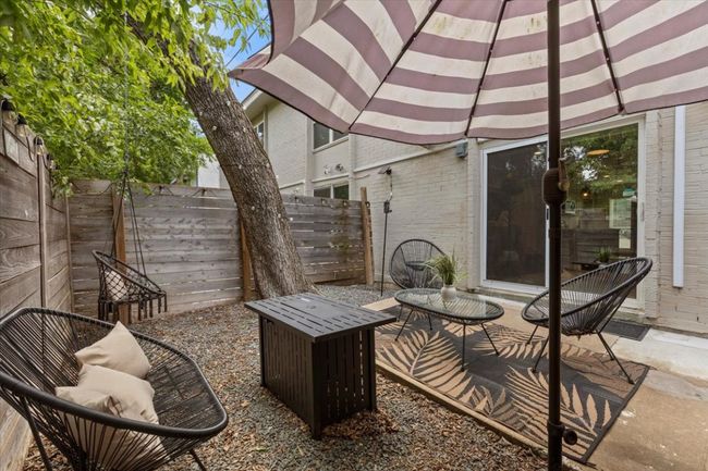 Fenced backyard with a patio | Image 4