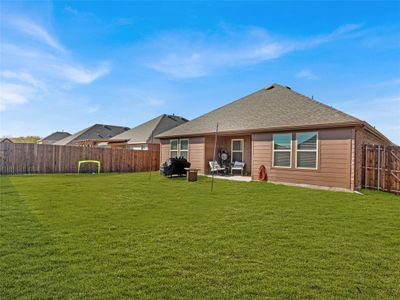 Back of property with a yard and a patio - grass is digitally enhanced | Image 3