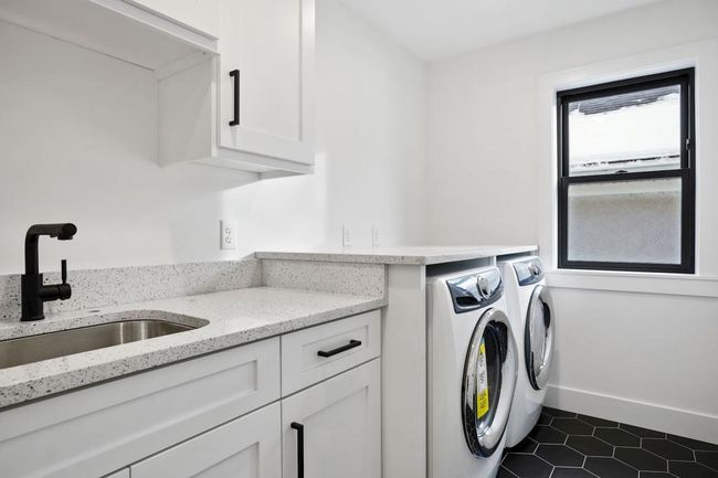 Convenient upstairs laundry with plenty of cabinets and counter space. Pictures of previously built house. | Image 23