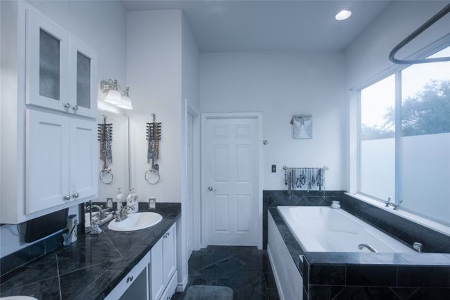 Bathroom featuring a garden tub, vanity, and recessed lighting | Image 18