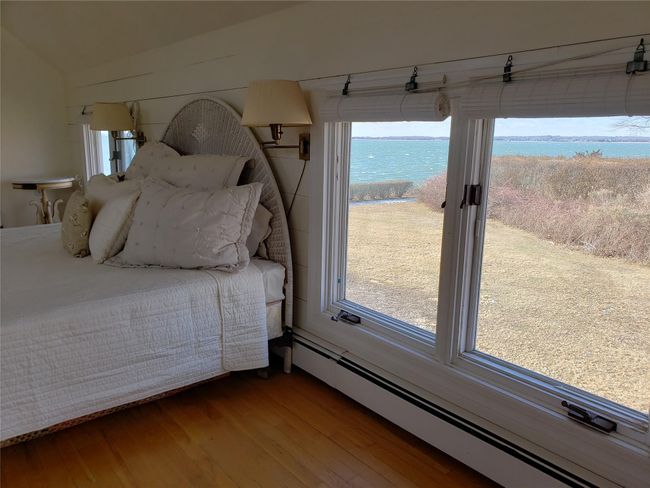 Shiplap bedroom with a waterview from side lawn | Image 37