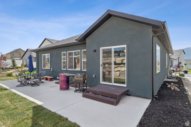 Back of property with a patio and stucco siding | Image 7