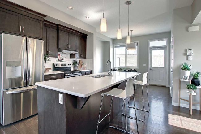 558 Panatella Walk Nw, Home with 2 bedrooms, 2 bathrooms and 3 parking in Calgary AB | Image 2