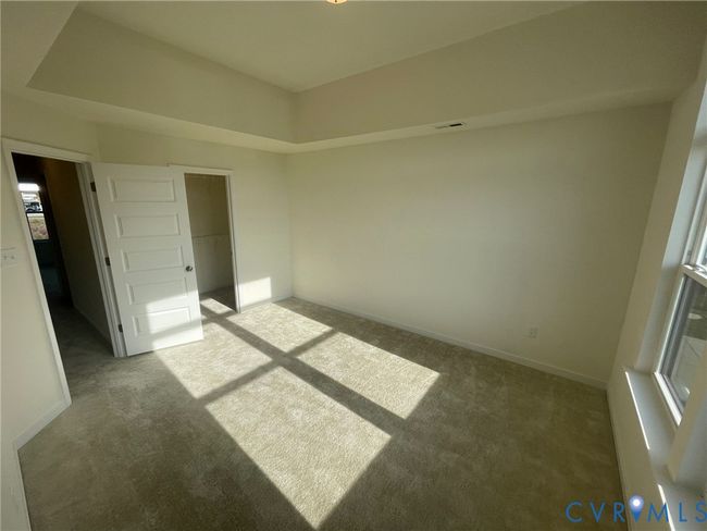 Unfurnished bedroom featuring carpet flooring and a closet | Image 11