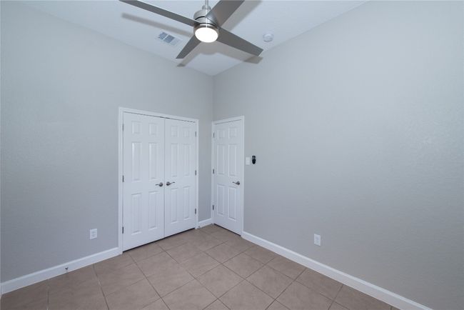Bedroom 3 of 3, double doors are closet doors, door on right is entrance | Image 26