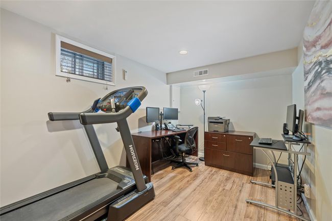 Office space featuring recessed lighting, light wood-style flooring, visible vents, and baseboards | Image 33