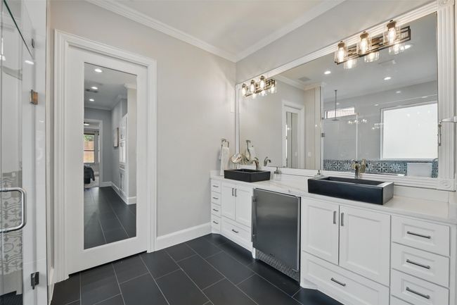 New flooring, lights, cabinets with fridge for those evening nightcaps and beauty products. | Image 19