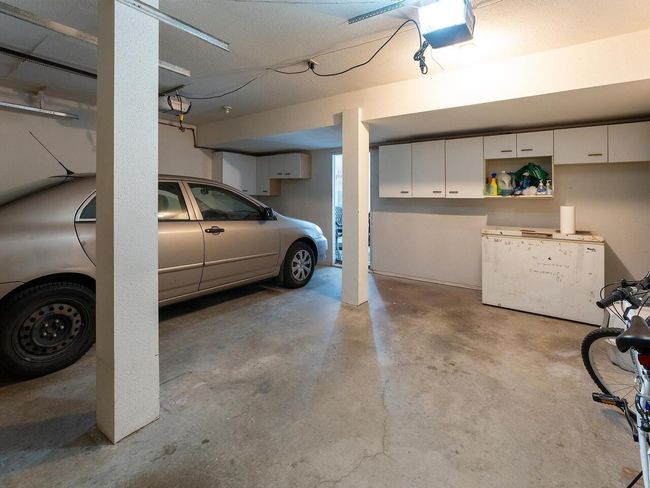 Garage with a garage door opener | Image 30
