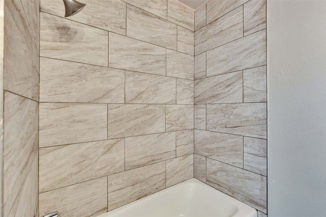 Primary Bathroom attached to primary bedroom with updated shower, light fixtures and vanity. | Image 23