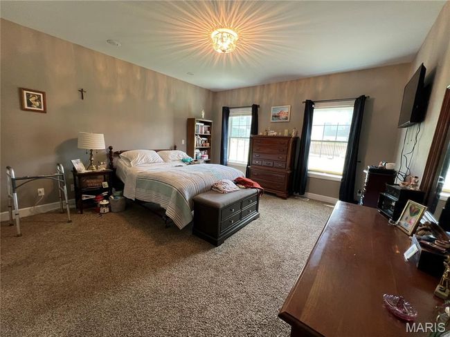 Bedroom featuring baseboards and carpet flooring | Image 9