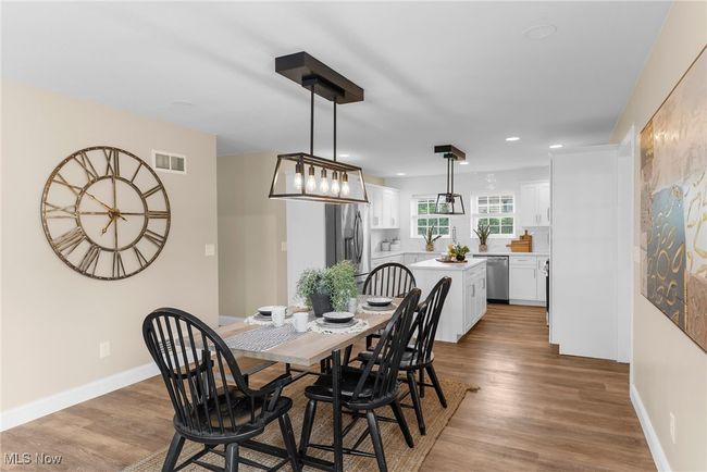 Dining room featuring wood finished floors and recessed lighting | Image 6