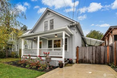 The large carport keeps cars, tools and toys dry plus the extra paved parking area in the front is a bonus for you and your guests. | Image 2