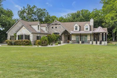 View of front of house featuring a front yard and covered porch | Image 2