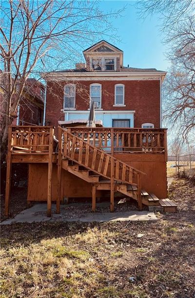 Back of property with a wooden deck | Image 3