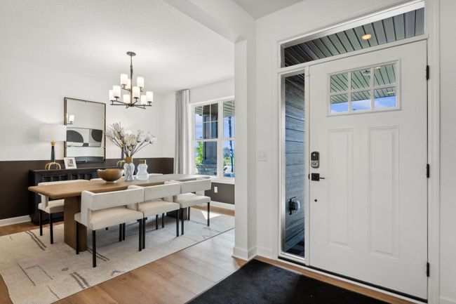 (Photo of a decorated model, actual homes finishes will vary) The formal dining room is just off the foyer. | Image 7