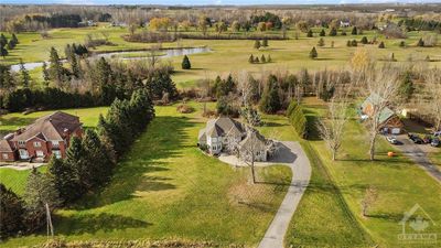 Perfectly positioned on nearly 2 acres of picturesque land. Embrace the serenity of country living with Bearbrook Golf Course right at your backyard, all while being just 25 minutes from downtown Ottawa. | Image 2