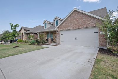 View of front of property with a garage and a front yard | Image 2