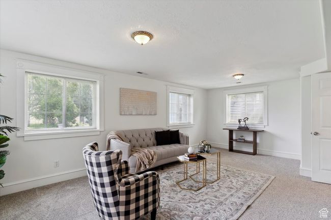 Living area with carpet, plenty of natural light, and baseboards | Image 22