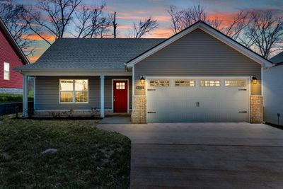 Sample picture from a previous build showing the Big Easy floor plan only. Materials and colors are subject to vary. Home will not have brick. | Image 1