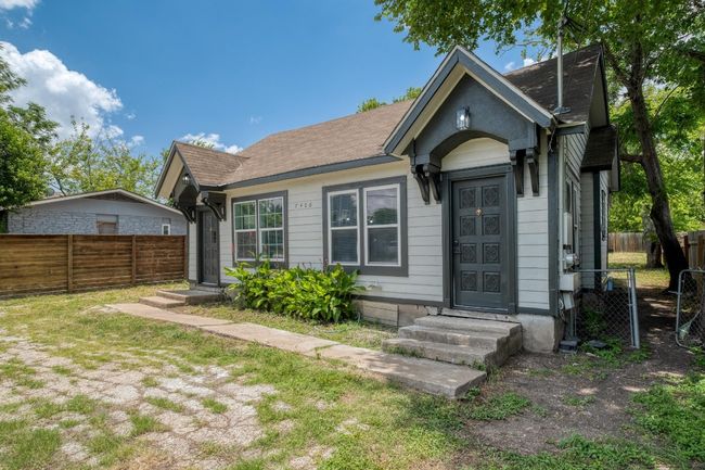 View of front facade featuring entry steps, a fenced backyard, and roof with shingles | Image 17