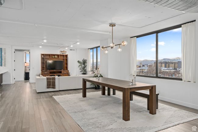 Dining room with a chandelier LVP flooring | Image 14