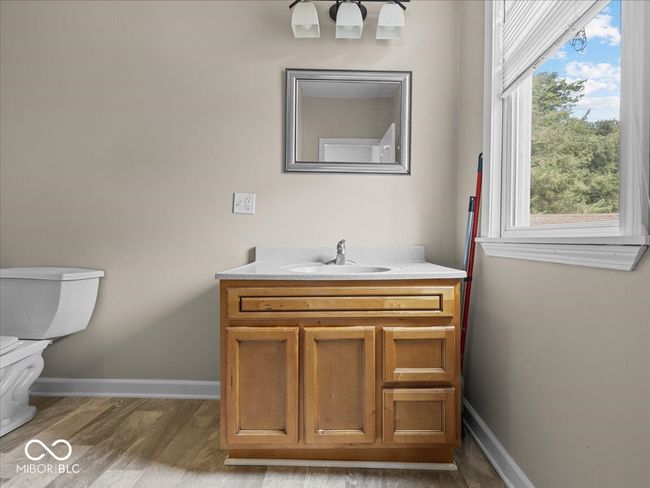 bathroom with vanity and wood finished floors | Image 20