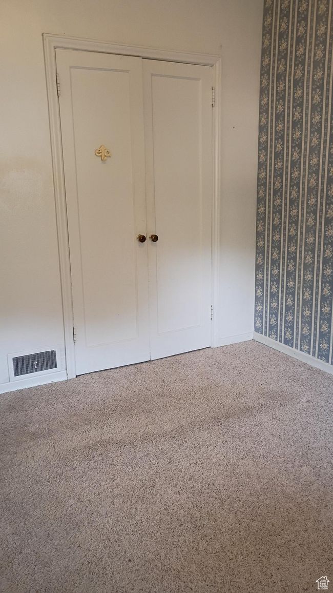 Bedroom with carpet and baseboards | Image 28