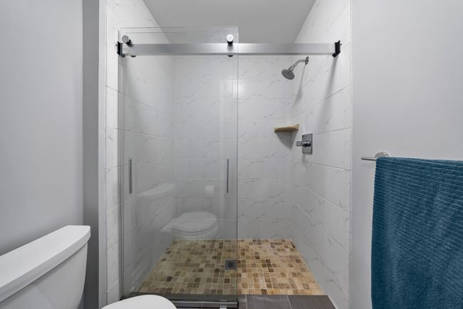 and Walk in shower with tile to ceiling | Image 46