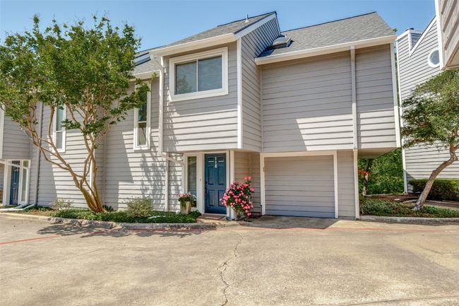 Townhome / multi-family property featuring a shingled roof | Image 25