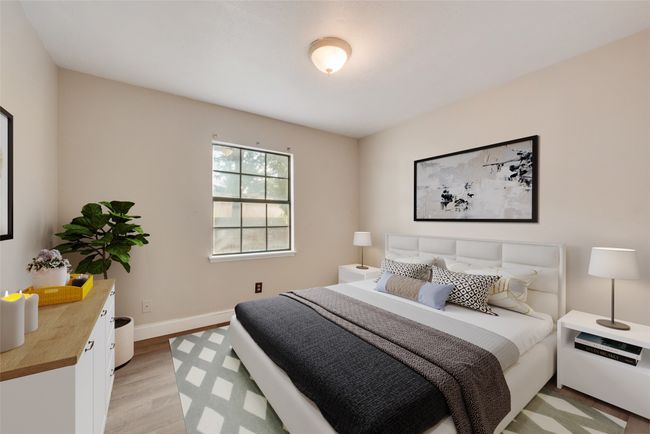 Bedroom featuring light wood-type flooring and baseboards | Image 10