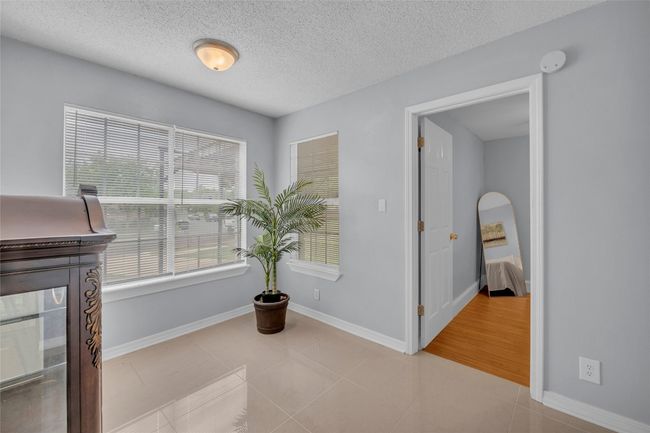 Office area next to foyer and guest bedroom. | Image 10