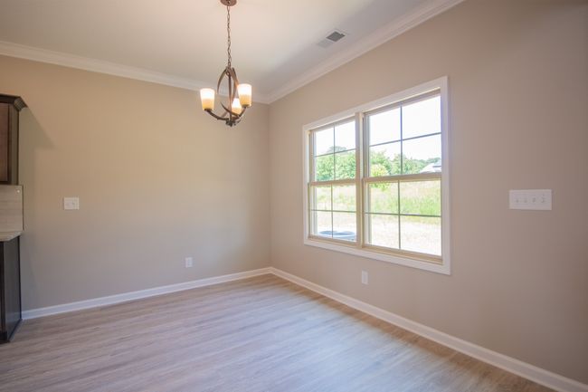 Eat-In Area with a Beautiful Chandelier and Natural Lighting Overlooking the Backyard! | Image 8
