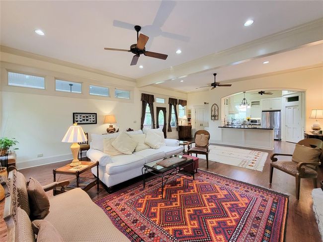 Enjoy modern comforts in the spacious living room and kitchen, perfect for entertaining and casual gatherings since 2010. | Image 13