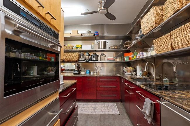 A beautifully designed Butler's pantry features a full-size commercial freezer, Wolf wall oven, two burner glass stove top and second dishwasher ideal for effortless entertaining and additional prep space | Image 26