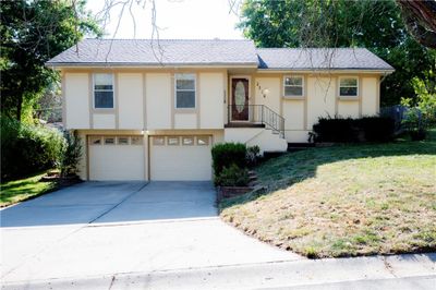 View of front of home featuring a front lawn and a garage | Image 3