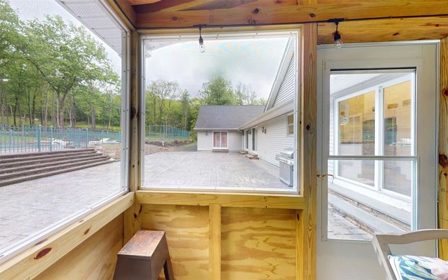 Unfurnished sunroom featuring healthy amount of natural light | Image 17