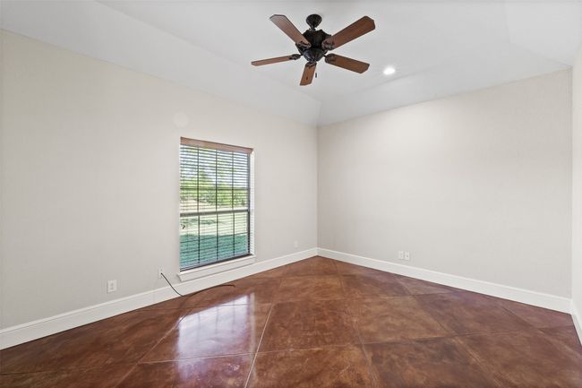 Tiled spare room featuring ceiling fan, baseboards, recessed lighting, and vaulted ceiling | Image 25