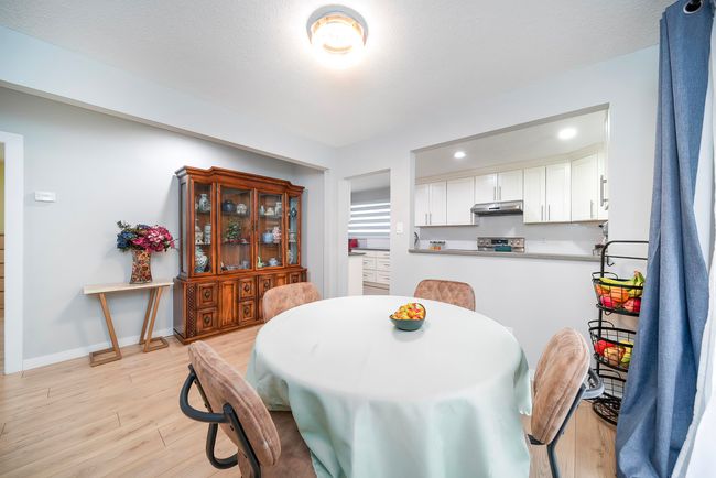 Dining space with baseboards, a textured ceiling, light wood-style flooring, and recessed lighting | Image 20