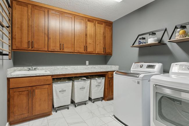 Upper level laundry - completely renovated with new floors and cabinets | Image 28